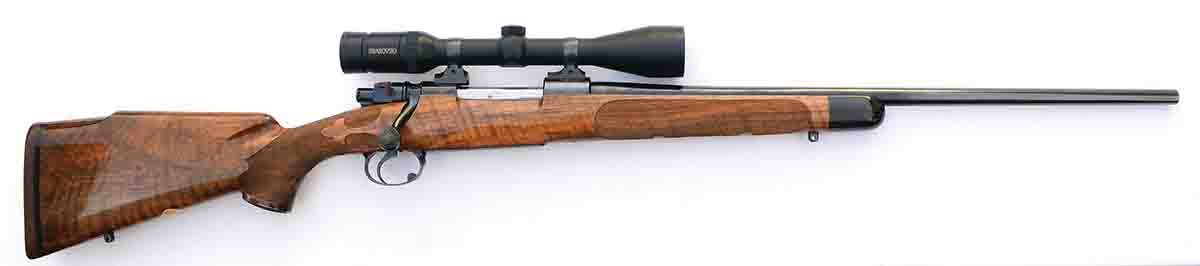 Built on an FN Deluxe action by Al Biesen around 1985, with a 3-10x 42mm Swarovski scope, unloaded and without a sling, the  rifle weighs 8 pounds, 2 ounces.